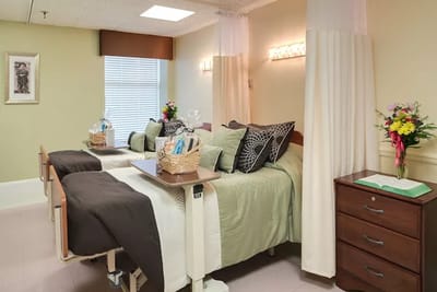 A cozy resident room with two beds and decorations