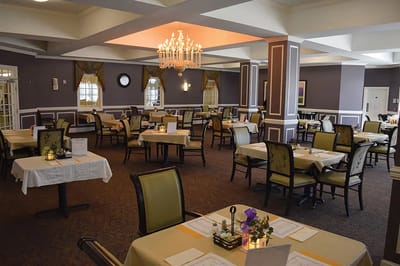 Dining room setup with tables and chairs