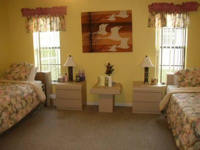 Cozy resident room with two beds and decor