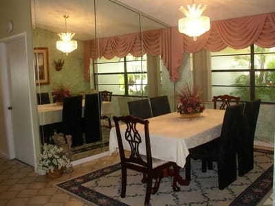 Elegant dining room with a large table and chandelier