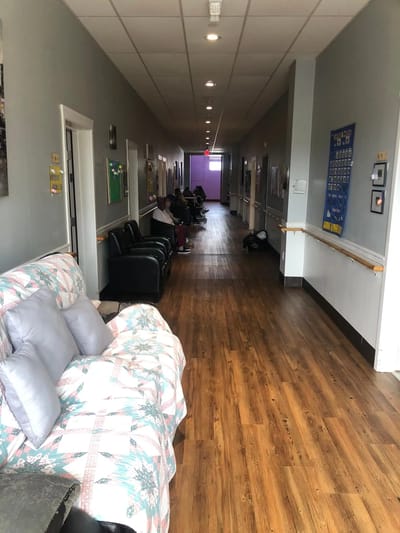 Interior corridor with seating and residents