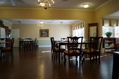 Dining area with tables and chairs in a well-lit room