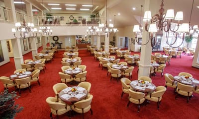 Dining area with round tables and decorative arrangements