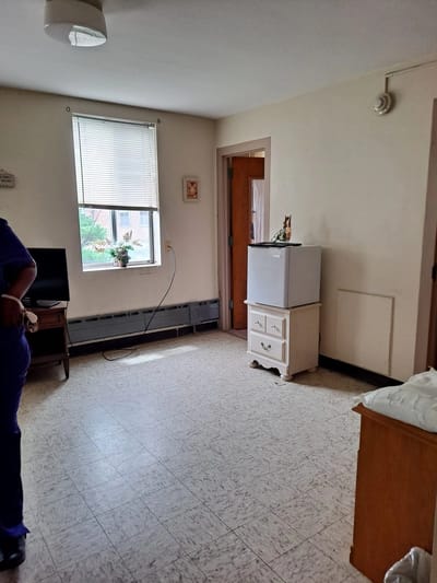 Interior of a resident room with furniture and window