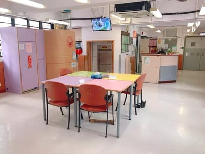 Bright activity room with tables and chairs