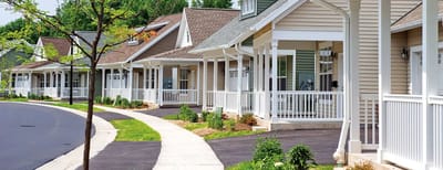 Cottages with walkways in a landscaped area