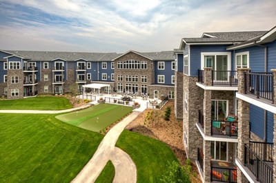 Aerial view of the facility with green lawn and walkways