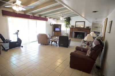 Interior common area with seating and TV