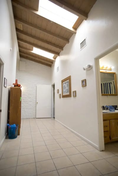 Interior hallway with skylights and artwork