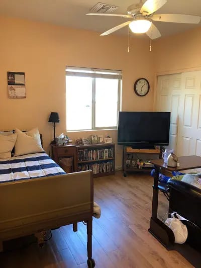 Private resident room featuring a bed and television