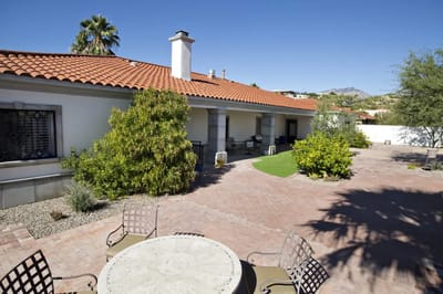 Outdoor area with gardens and seating at the facility