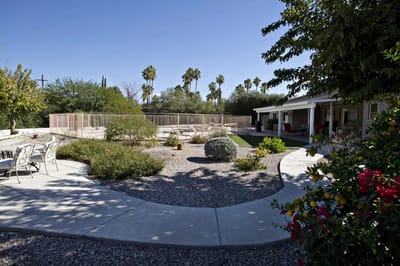Outdoor space with seating and a pool area