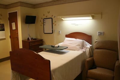 Cozy resident room with a bed and seating area
