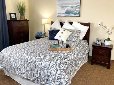 Cozy resident bedroom with elegant decor and a tray of items