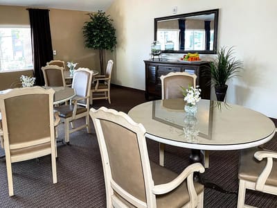 Bright interior common area with dining tables