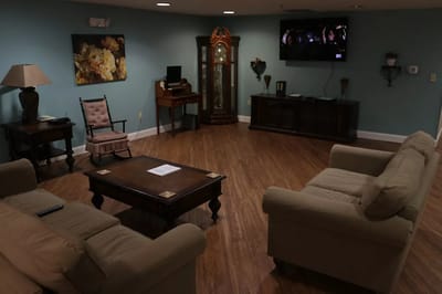 Common area with seating and TV in the facility