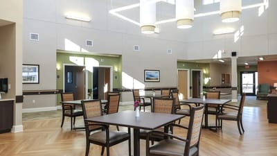 Bright interior of a common area with tables and chairs