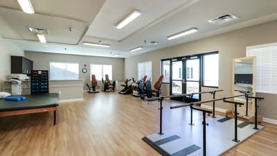 Interior view of a rehabilitation exercise area with equipment