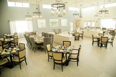 Bright, open dining room with elegant table settings