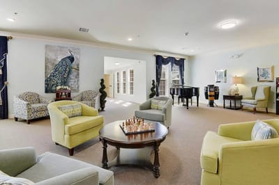 Bright common area with seating and chess set