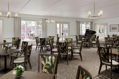 Bright dining area with tables and chairs
