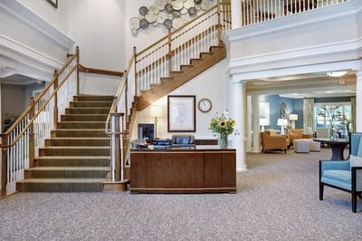 Lobby area with a staircase and seating