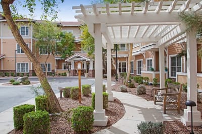 Outdoor seating area with landscaping and a pergola