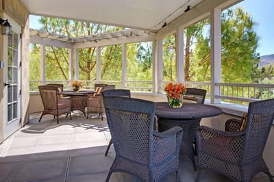 Outdoor seating area with plants and flowers