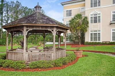 Gazebo in a landscaped garden area next to the building