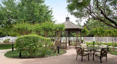 Outdoor garden area with gazebo and seating
