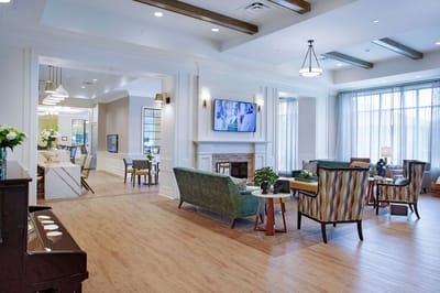 Bright common area with seating and a TV