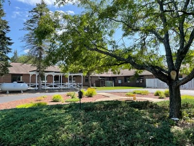 Exterior view of Suring Health and Rehabilitation Center with landscaping