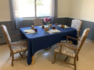 Dining table set for a meal in an interior space