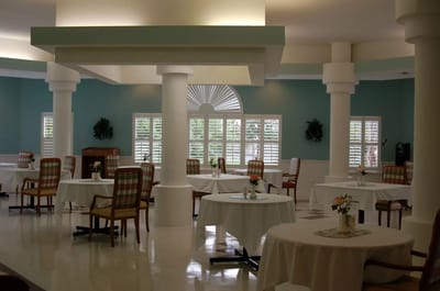 Dining area of a communal space with tables and chairs