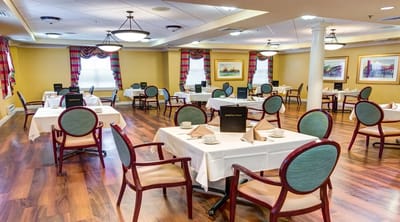 Dining room setup with tables and chairs