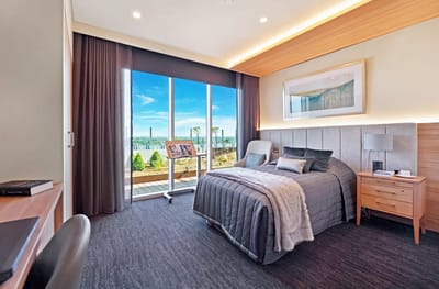 Brightly decorated resident room with outdoor view