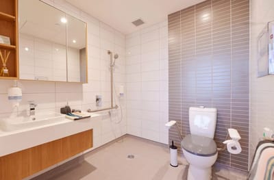 Bright, modern bathroom in a resident room