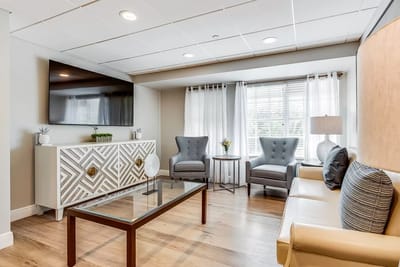 Bright interior common area with seating and decorations