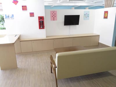 Bright common area with seating and wall decorations