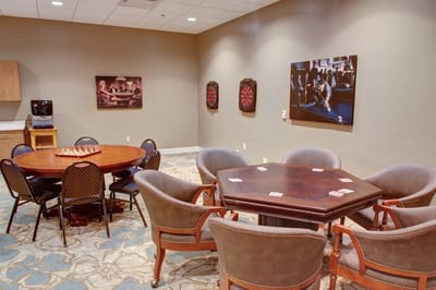 Activity room with game tables and dartboard