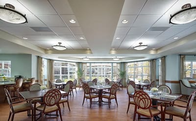 Bright dining area with tables and chairs
