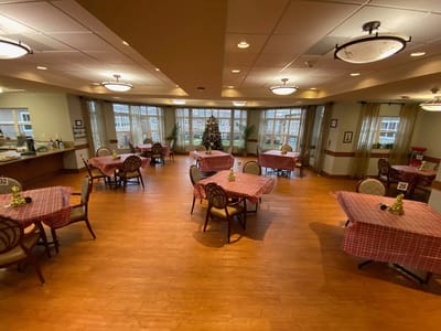 Dining area set up for residents with festive decor