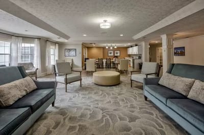 Bright common area with seating and dining space
