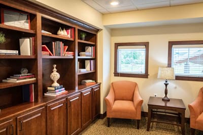 Cozy reading nook with bookshelves and seating