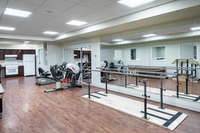 Interior view of a rehabilitation gym with equipment