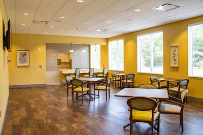 Bright dining room with tables and chairs