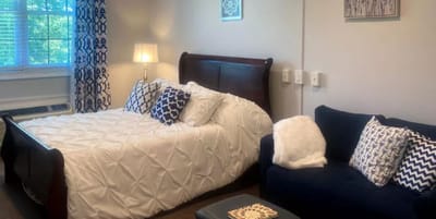 Cozy private resident room with bedding and seating area