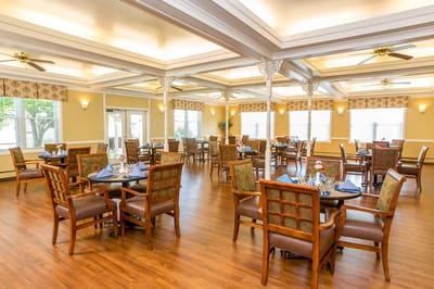 Dining area with tables and seating set for meals