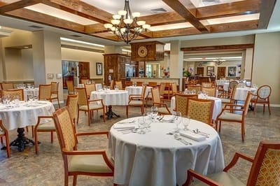 Elegant dining room with tables set for meals