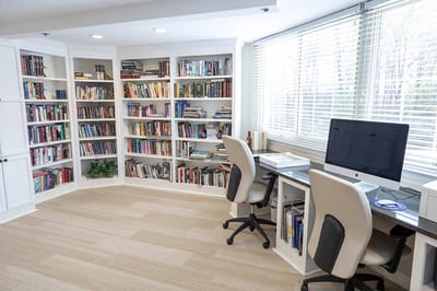 Bright reading area with bookshelves and computer